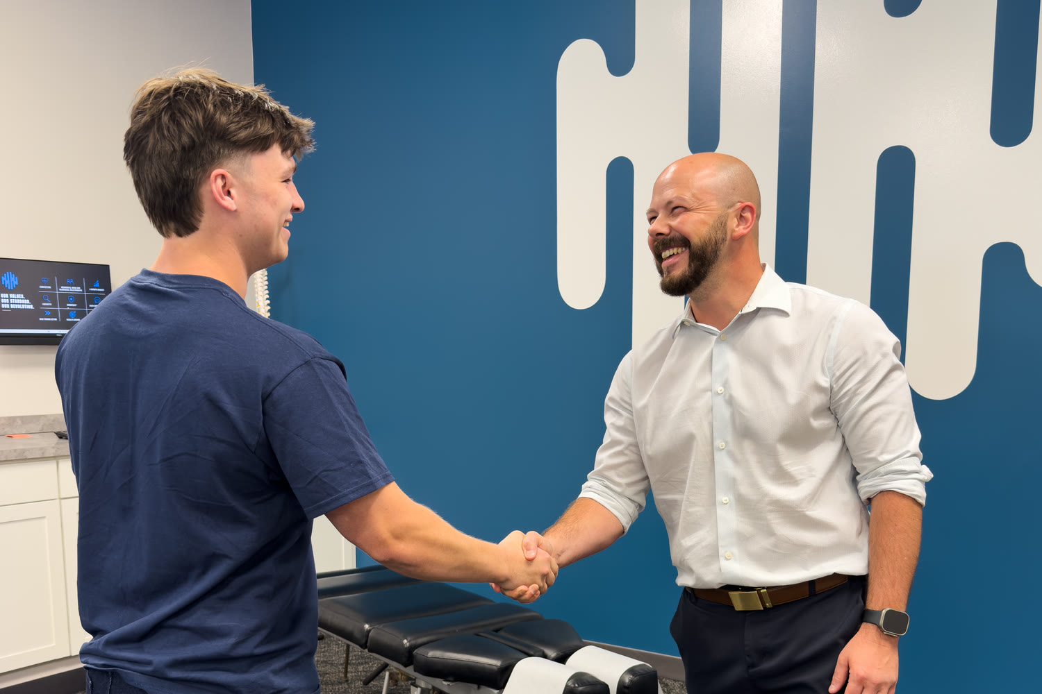 An Ability Chiropractic doctor shaking hands with a patient in the clinic